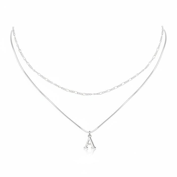 Minimalist silver layered necklace featuring a sleek snake chain with an initial A pendant and a delicate figaro link chain