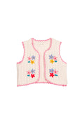 A cream-colored knit vest with pink trim and colorful embroidered flowers, shown flat on a white background.
